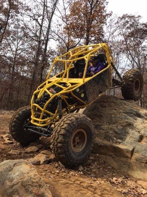 yellow buggy in mud